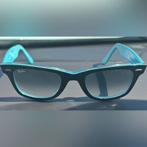 Ray-Ban Wayfarer. Black with blue ombré on lens and blue inside.